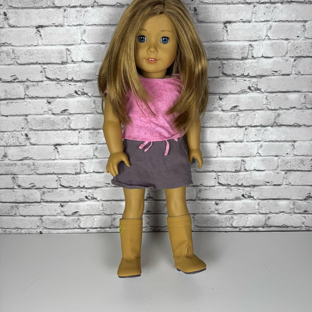 American Girl Doll with brown hair and blue eyes